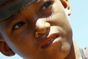Portrait of adorable young happy boy - african poor child